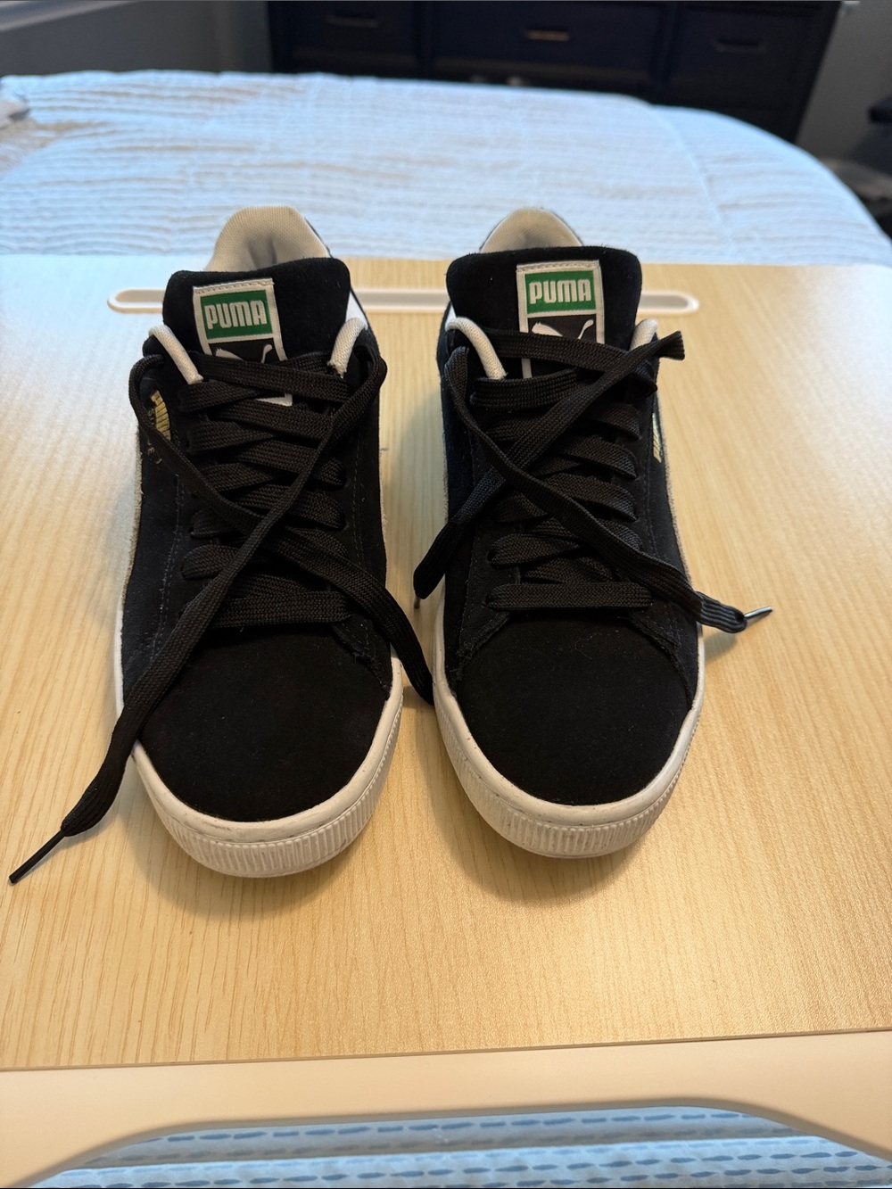 Puma Black Suede Sneakers with White Soles and Green Logo
